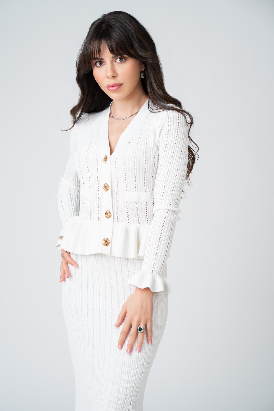 Elena in a white dress outdoors